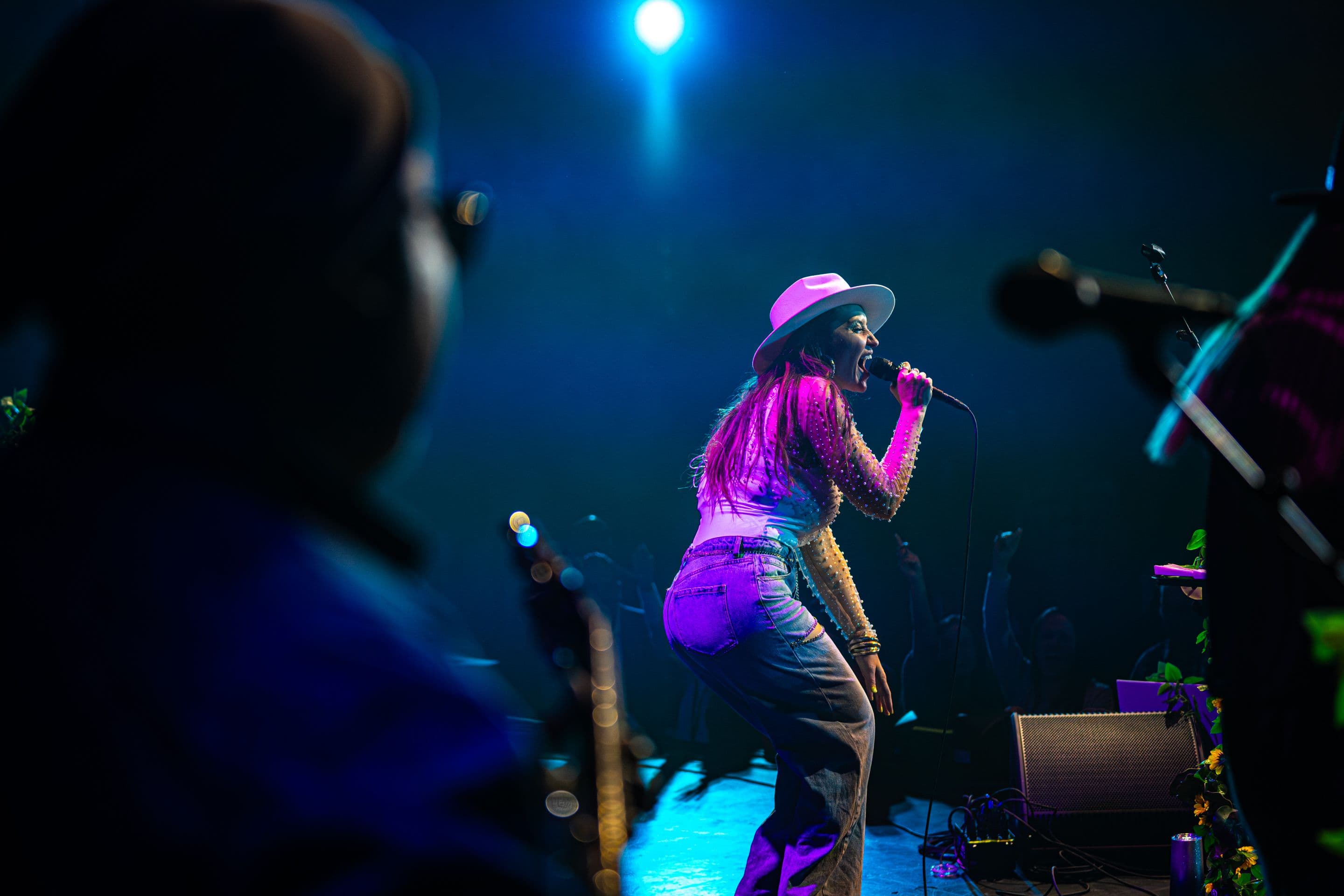 Anuhea singing on stage